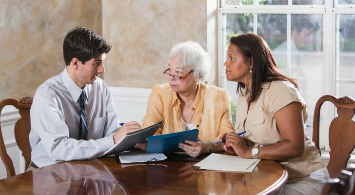 A mother and daughter meet with an advisor to discuss setting up a spendthrift trust.