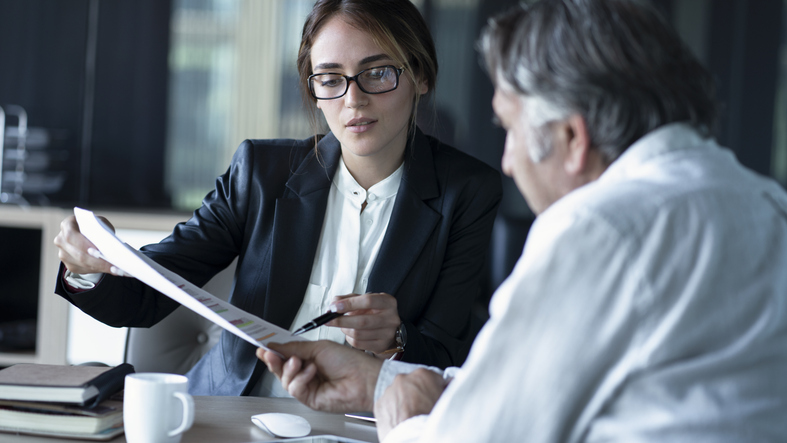 Advisor discussing the tax consequences of inheriting a cd with a client.